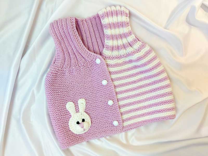 В'язана дитяча жилетка для дівчинки рожевого кольору